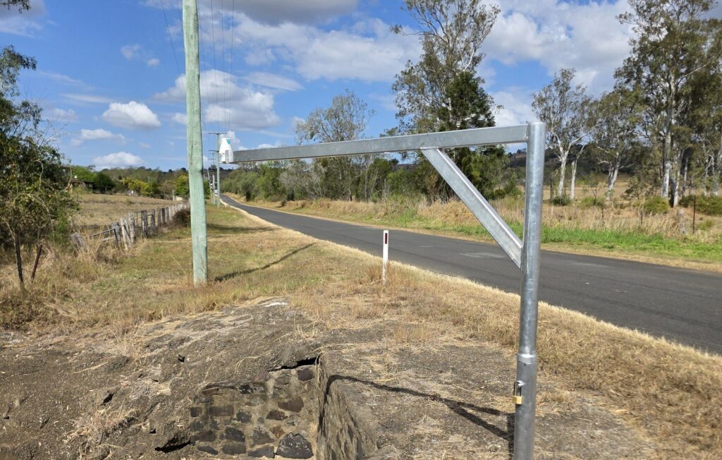 Low-cost flood gauge installed beside a rural road