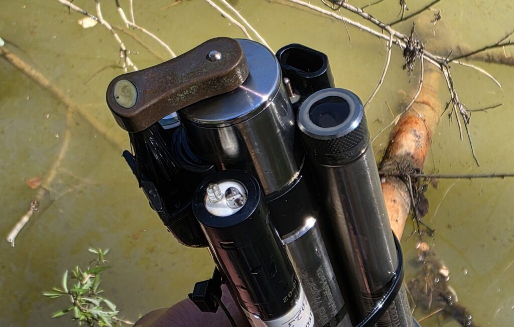Water quality sonde being serviced at a creek site